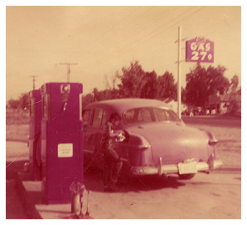 Old Car Being Filled with Gas